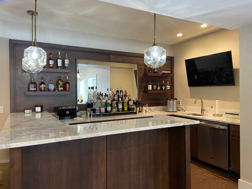 Lower level wine bar of a courtyard ranch home