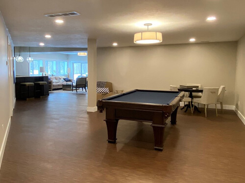 Lower level rec room of a courtyard ranch home