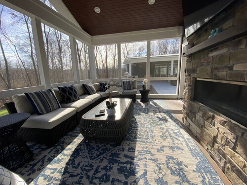 Covered outdoor seating area of a courtyard ranch home
